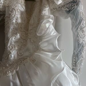 Beautiful beaded wedding dress with long train.